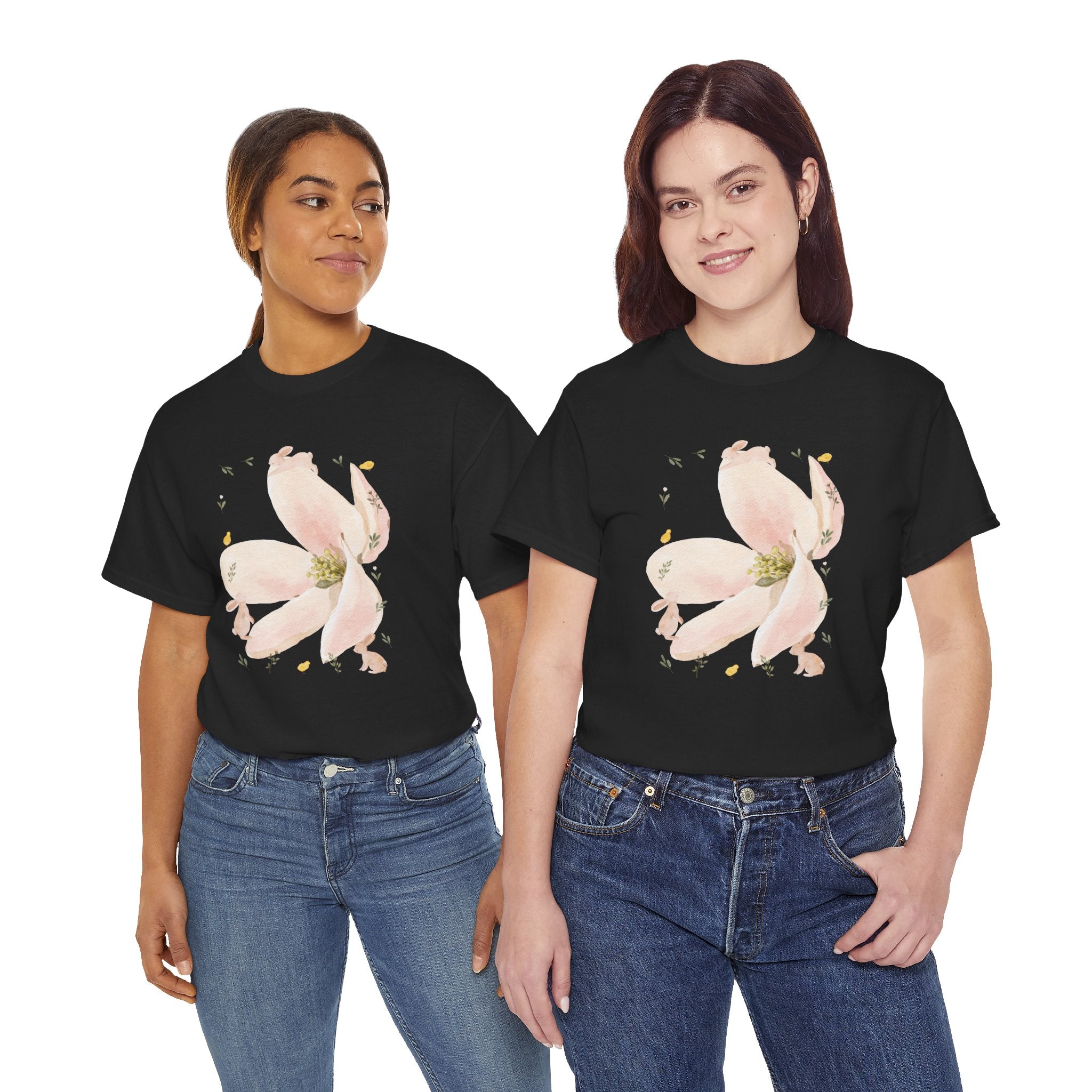 Two girls wearing black t-shirts featuring a graphic design of a pink bloom surrounded by bunnies in various poses.
