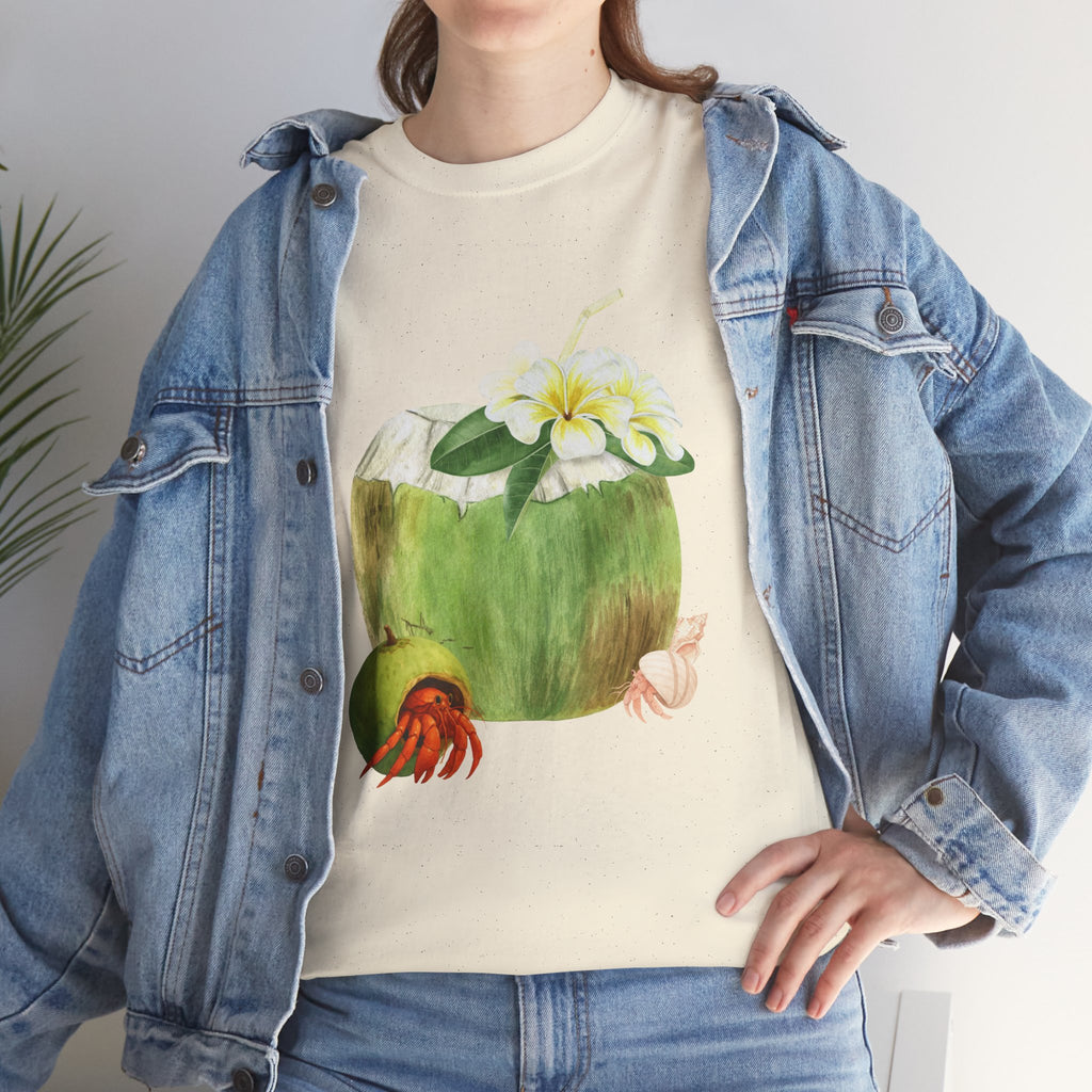 A girl wearing a denim jacket over a beige t-shirt featuring a colorful design of a hermit crab in a coconut shell and a straw-topped coconut.