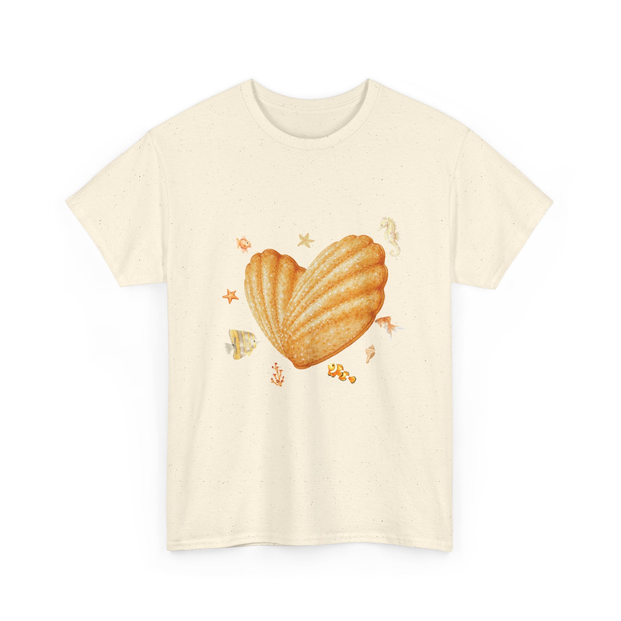 Beige t-shirt with a heart-shaped madeleine surrounded by yellow tropical fish, starfish, seahorses, and coral.