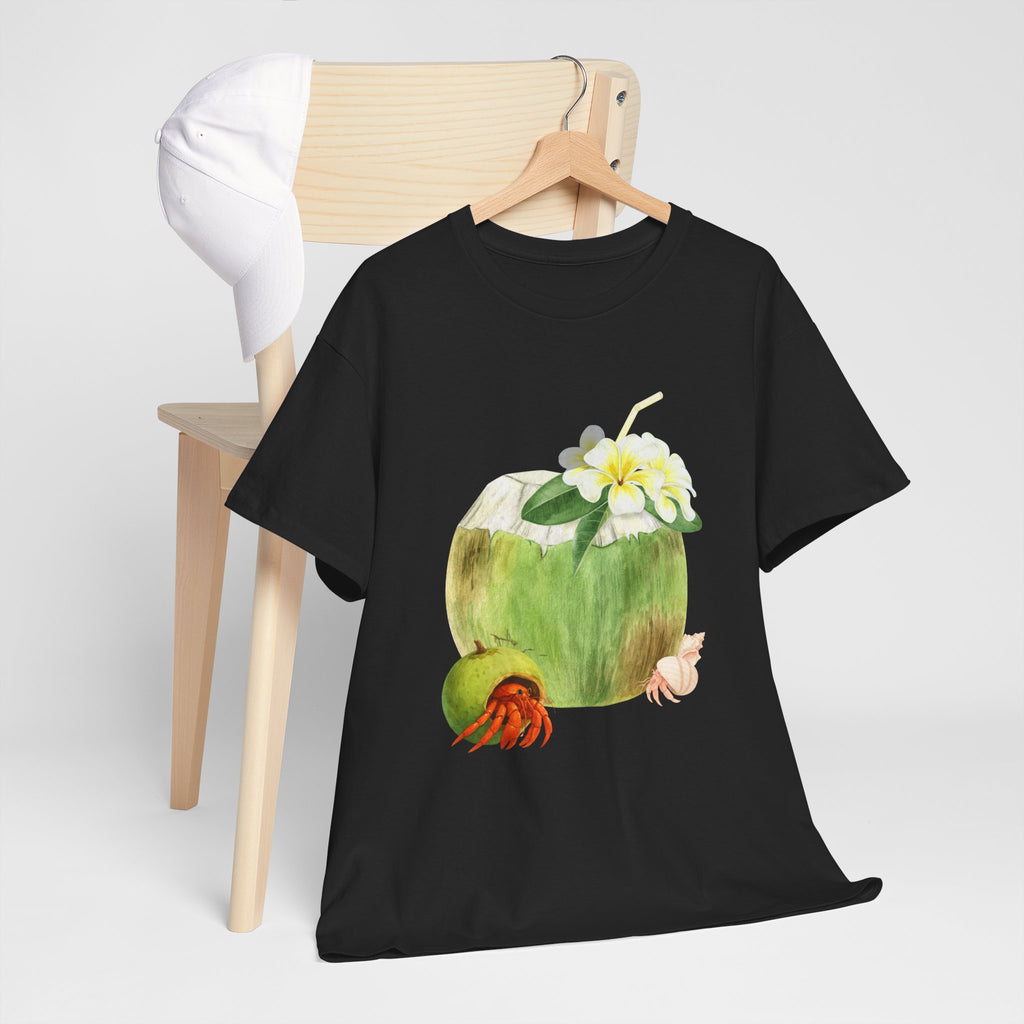 A black t-shirt hanging on a chair, featuring a graphic design of a hermit crab in a coconut shell and a straw-topped coconut.