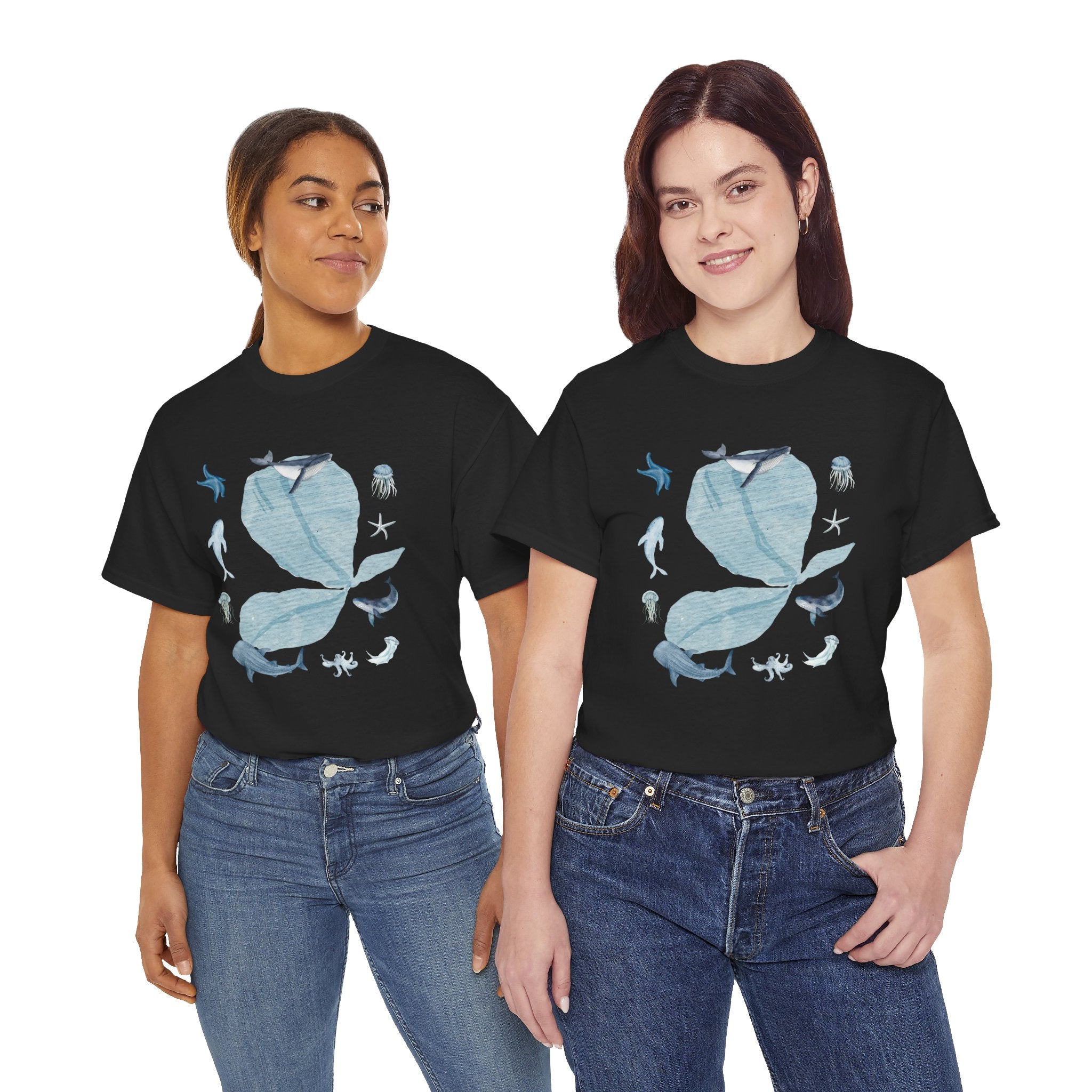 Two girls wearing black t-shirts featuring a graphic design of a blue bloom surrounded by whales, jellyfish, and starfish.
