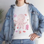 A girl wearing a denim jacket over a white t-shirt featuring a colorful design of a pink octopus multitasking its tentacles to apply lipstick, brush on makeup, and juggle beauty accessories.