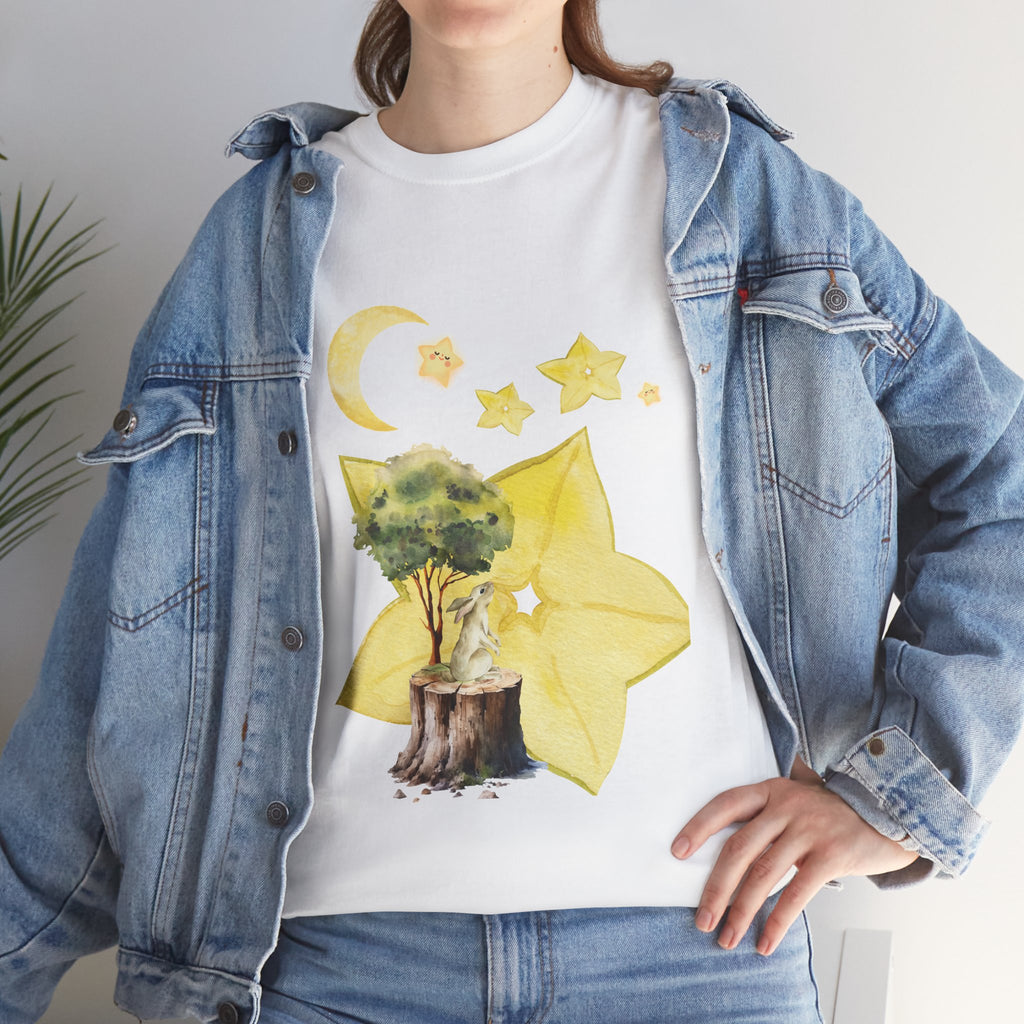 A girl wearing a denim jacket over a white t-shirt featuring a colorful design of a tree, moon, and starfruit celestial elements.