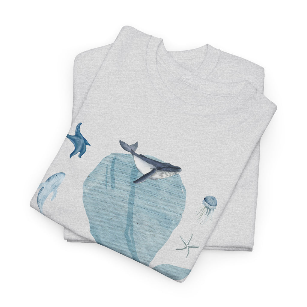 A folded grey t-shirt featuring a graphic design of a blue bloom surrounded by whales, jellyfish, and starfish.
