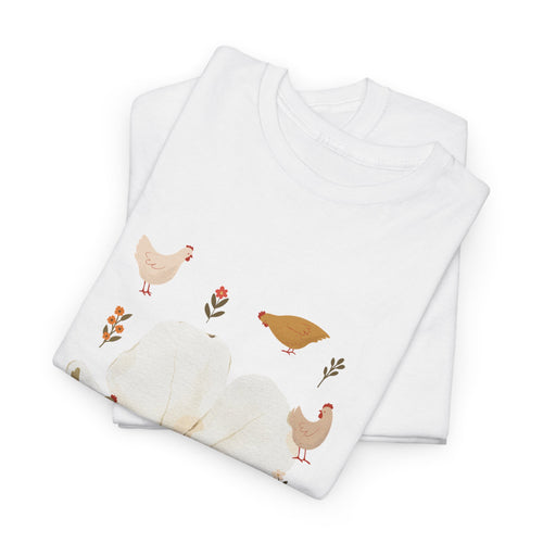 A folded white t-shirt featuring a graphic design of a bloom surrounded by roosters in various poses.