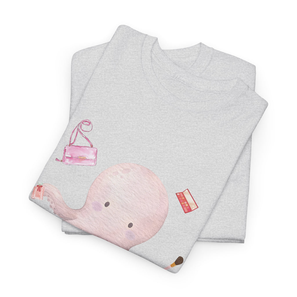 A folded grey t-shirt featuring a graphic design of a pink octopus multitasking its tentacles to apply lipstick, brush on makeup, and juggle beauty accessories.