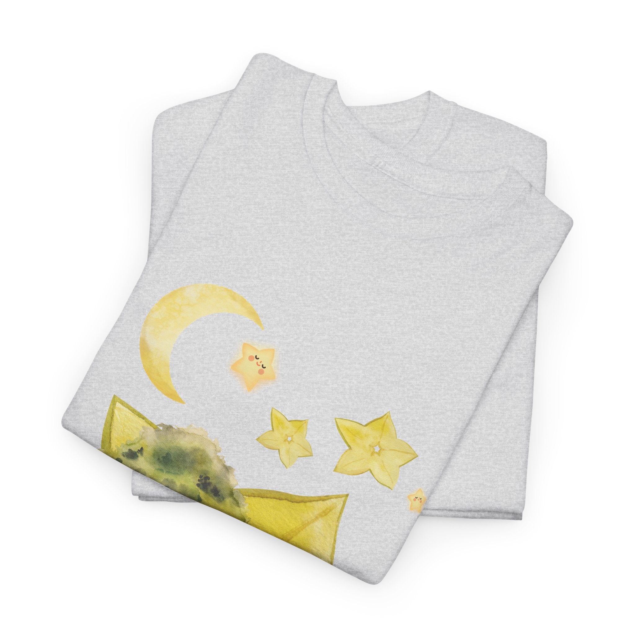 A folded grey t-shirt featuring a graphic design of a tree stump, leaves, and starfruit celestial elements.