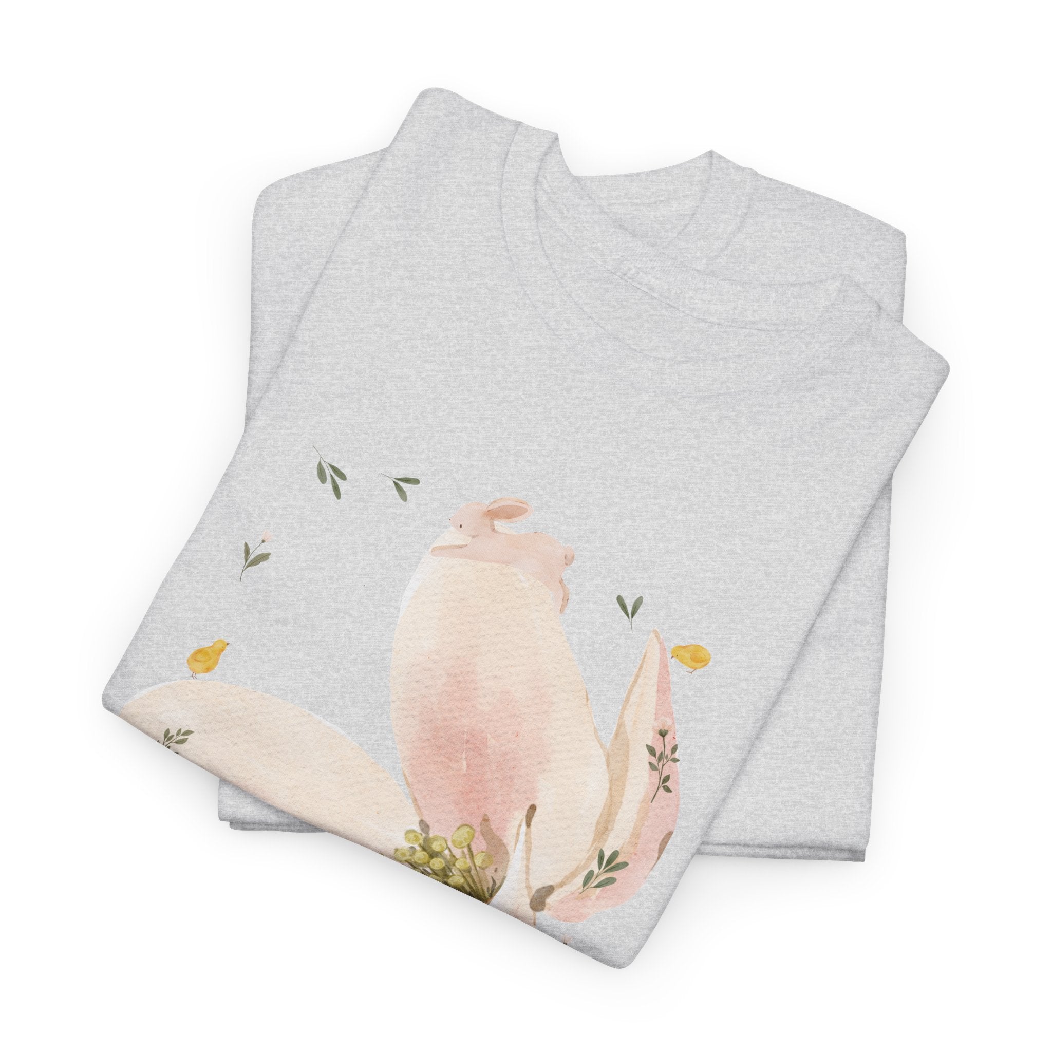 A folded grey t-shirt featuring a graphic design of a pink bloom surrounded by bunnies in various poses.