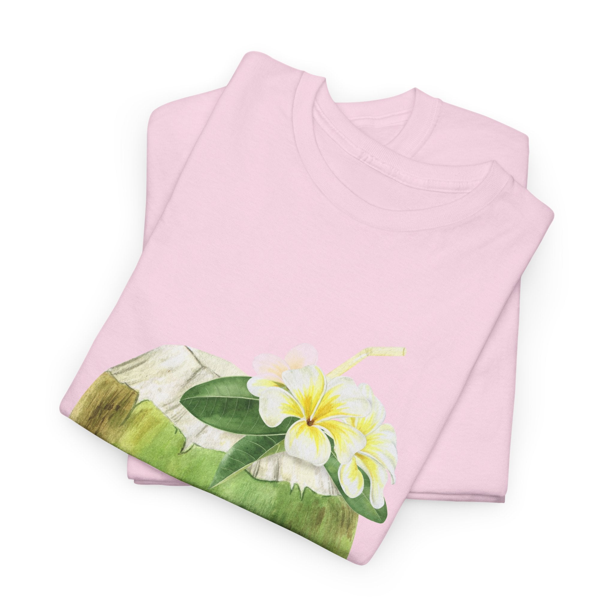A folded pink t-shirt featuring a graphic design of a hermit crab in a coconut shell and a straw-topped coconut.