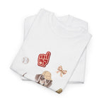 A folded white t-shirt featuring a graphic design of a dog in a baseball hat surrounded by a circle of balls, bats, and helmets.