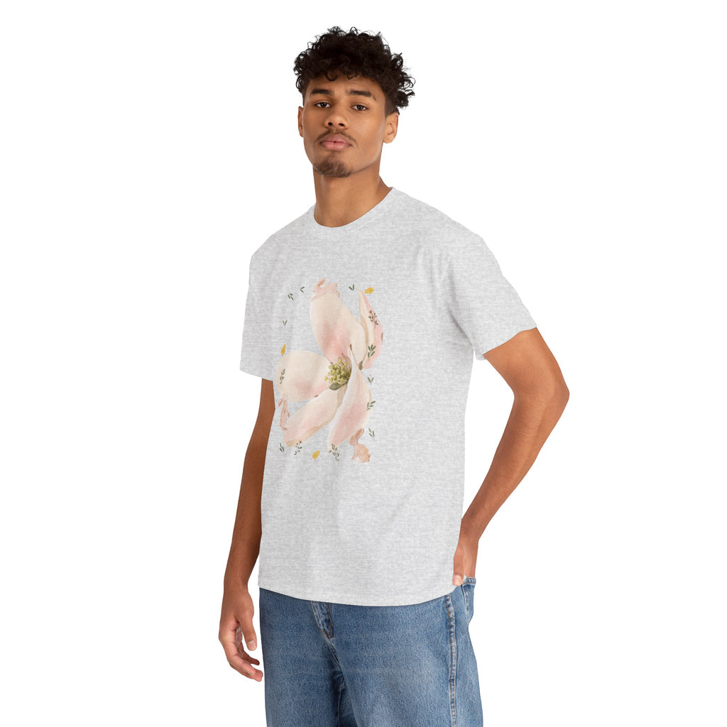 A man wearing a grey t-shirt featuring a graphic design of a pink bloom surrounded by bunnies in various poses.