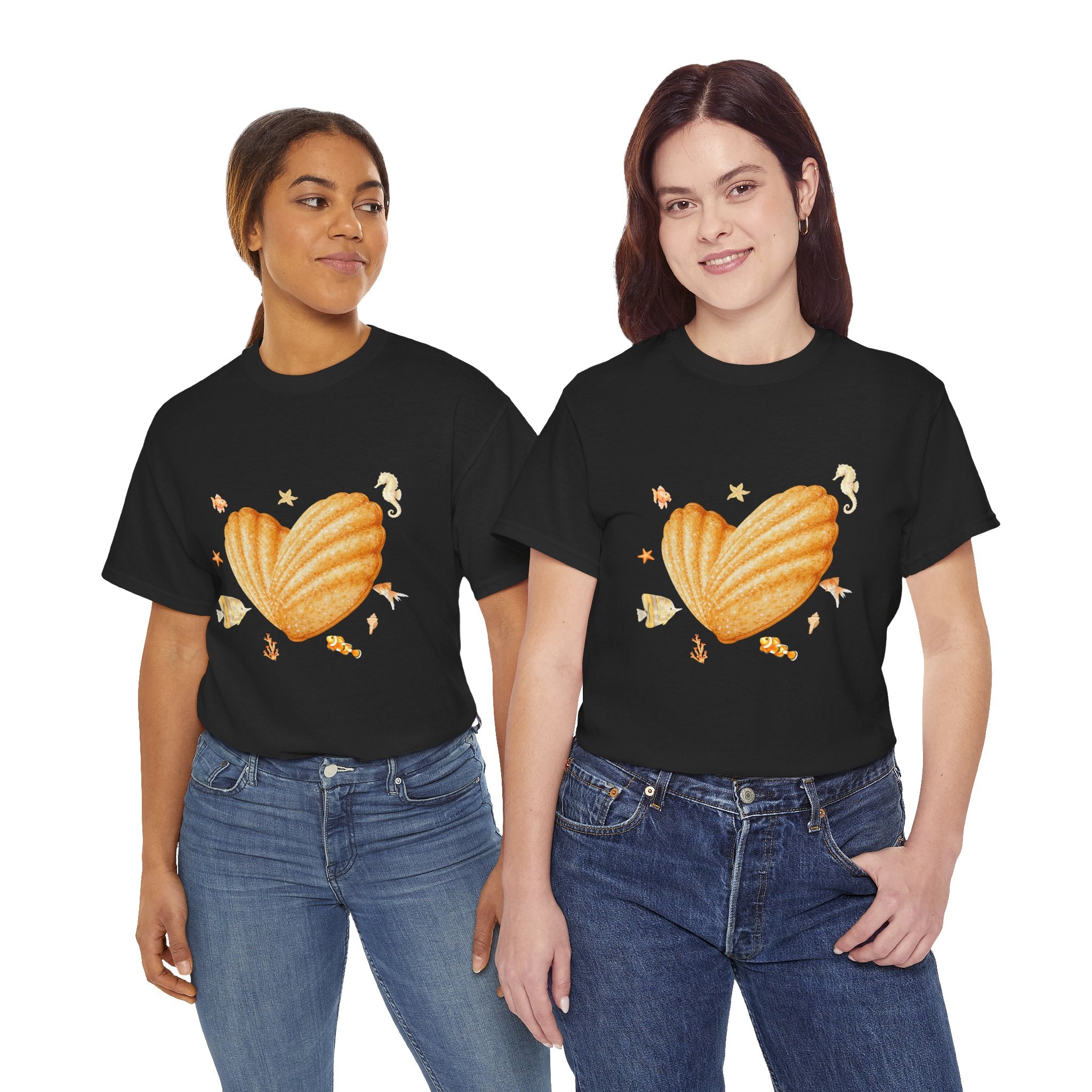 Two girls wearing black t-shirts featuring a graphic design of a heart-shaped madeleine surrounded by yellow tropical fish, starfish, seahorses, and coral.