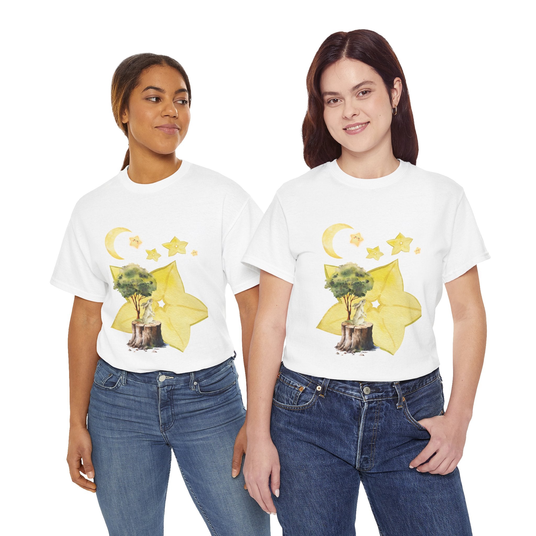 Two girls wearing white t-shirts featuring a graphic design of a tree stump, leaves, and starfruit celestial elements.