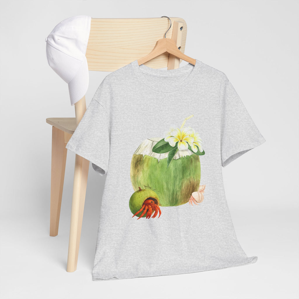 A grey t-shirt hanging on a chair, featuring a graphic design of a hermit crab in a coconut shell and a straw-topped coconut.