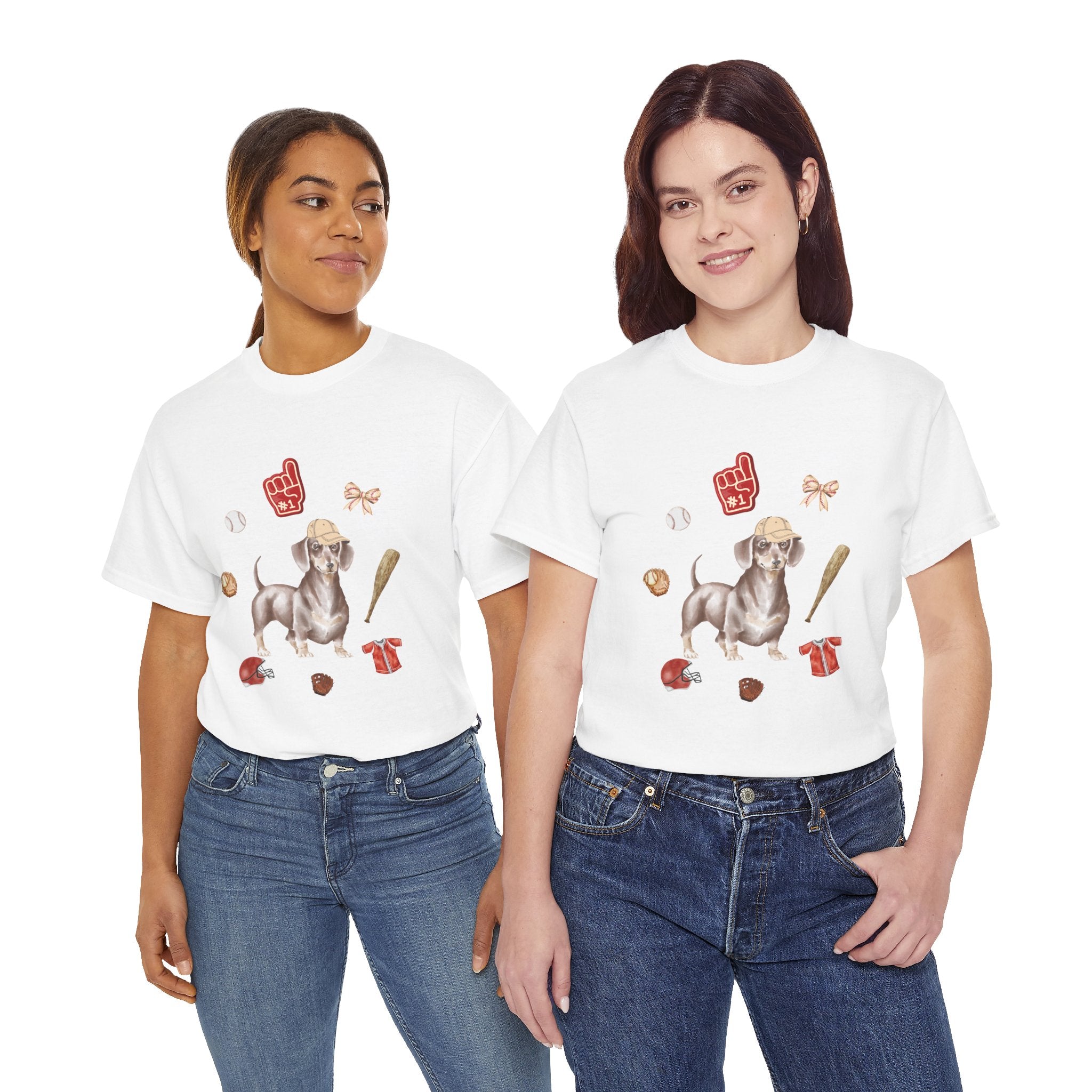 Two girls wearing white t-shirts featuring a graphic design of a dog in a baseball hat surrounded by a circle of balls, bats, and helmets.