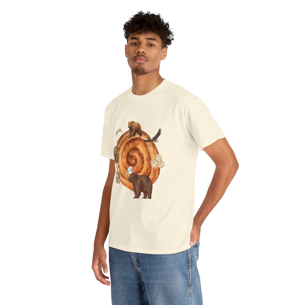 A man wearing a beige t-shirt featuring a graphic design of a cinnamon roll surrounded by several hungry bears.