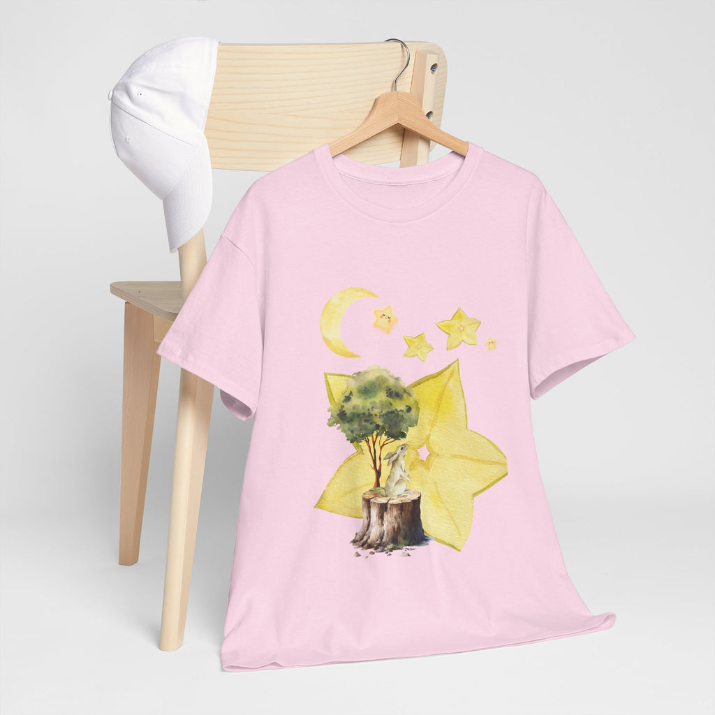 A pink t-shirt hanging on a chair, featuring a graphic design of a tree stump, leaves, and starfruit celestial elements.