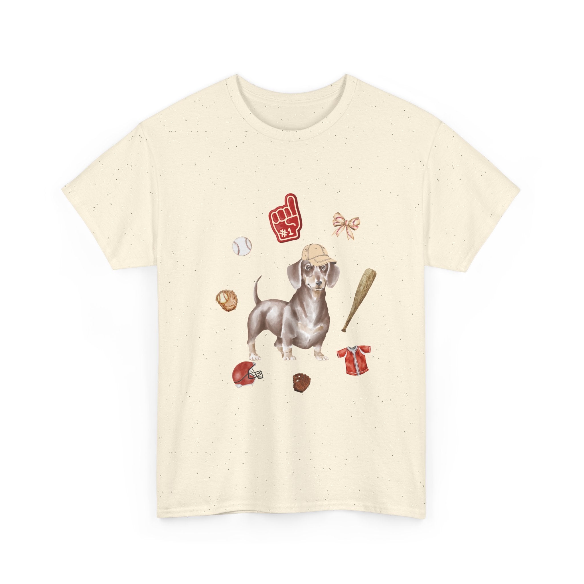 Beige t-shirt with a dog in a baseball hat surrounded by a circle of balls, bats, and helmets.