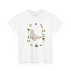 White t-shirt with a sea lion surrounded by green onions, cabbage, and broccoli.