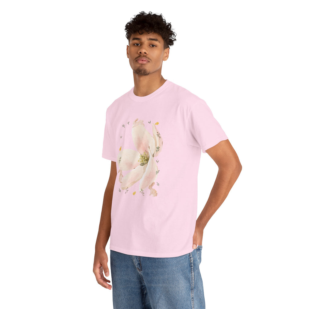 A man wearing a pink t-shirt featuring a graphic design of a pink bloom surrounded by bunnies in various poses.