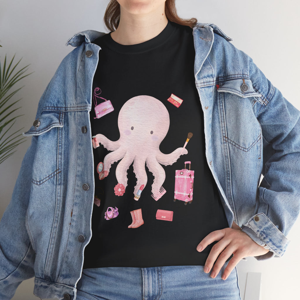 A girl wearing a denim jacket over a black t-shirt featuring a colorful design of a pink octopus multitasking its tentacles to apply lipstick, brush on makeup, and juggle beauty accessories.