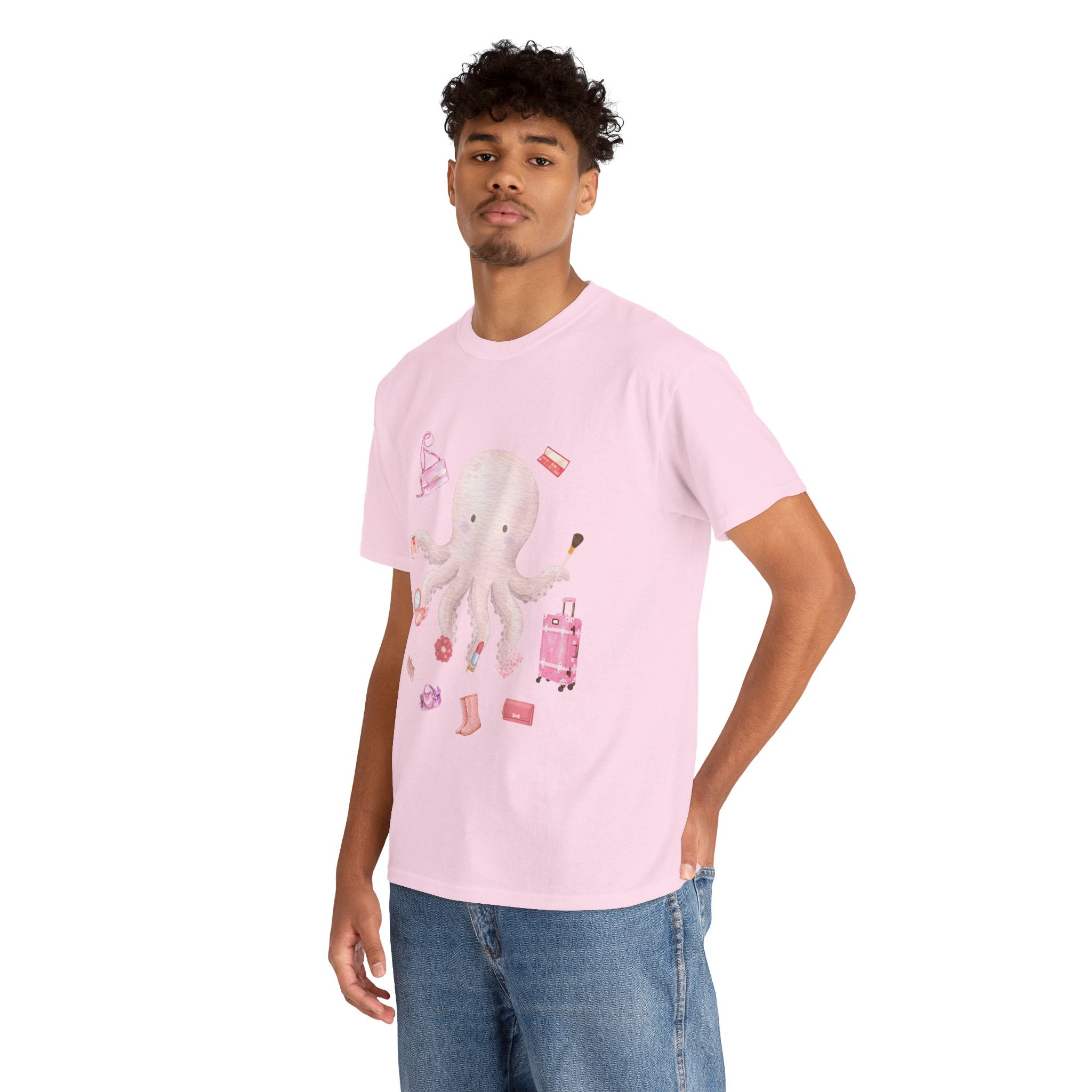 A man wearing a pink t-shirt featuring a graphic design of a pink octopus multitasking its tentacles to apply lipstick, brush on makeup, and juggle beauty accessories.