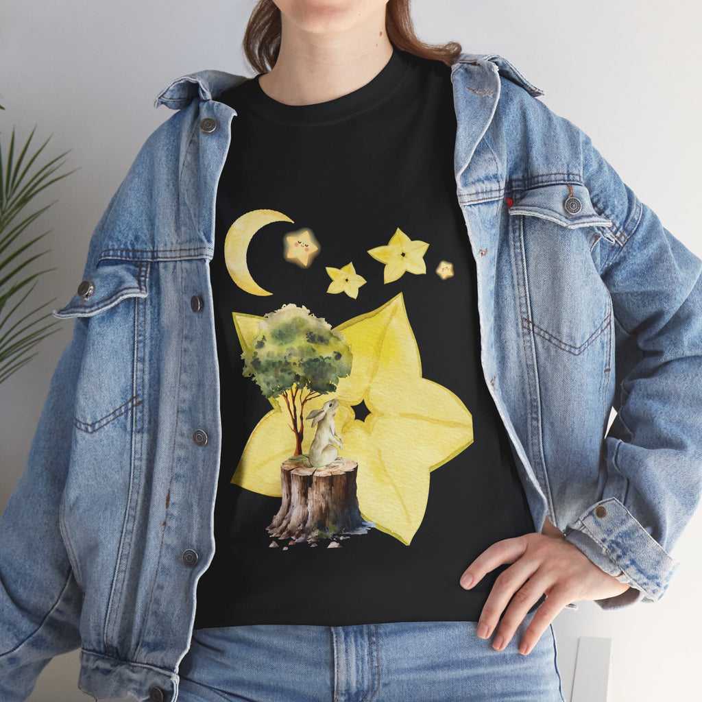 A girl wearing a denim jacket over a black t-shirt featuring a colorful design of a tree, moon, and starfruit celestial elements.