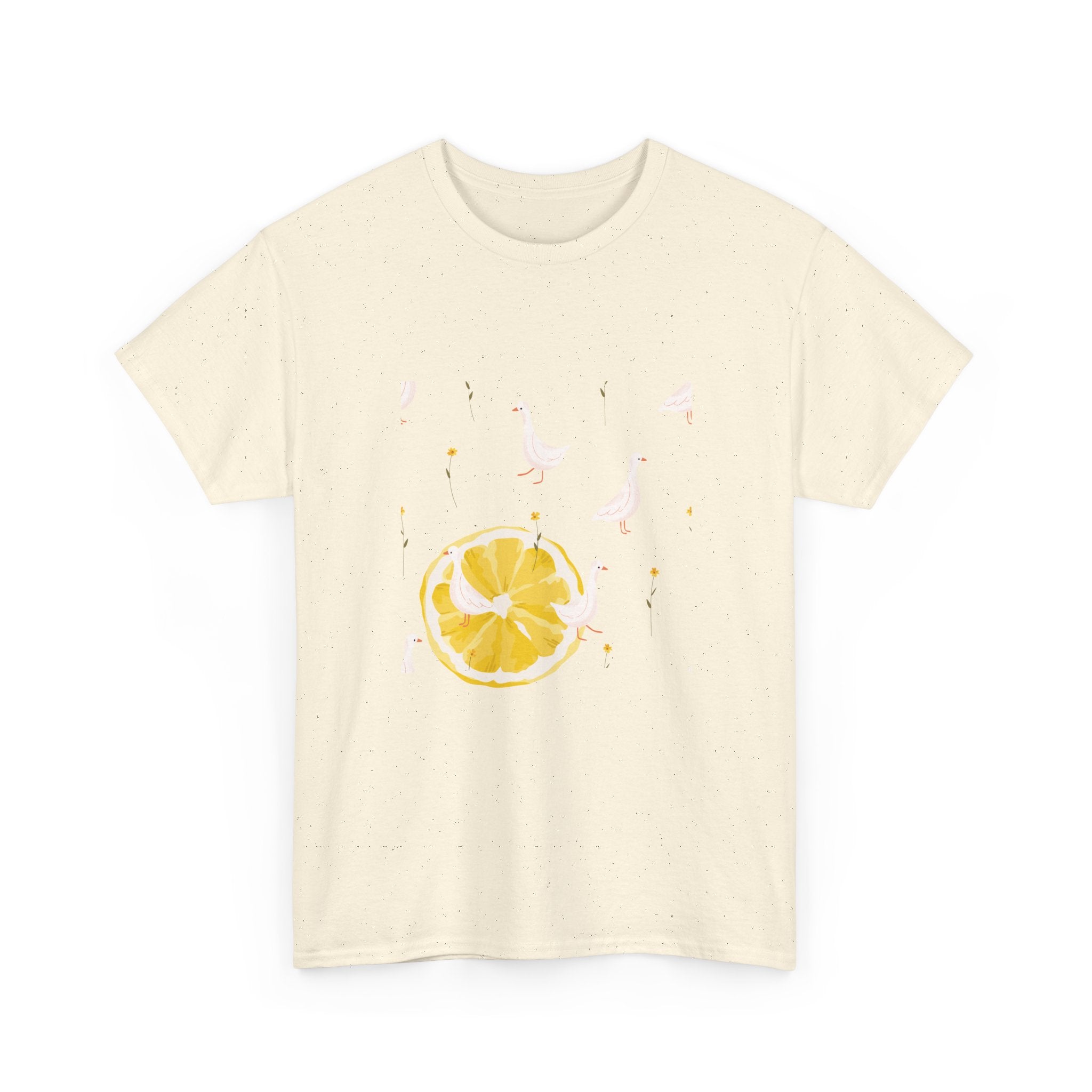 Beige t-shirt with a juicy lemon in the bottom-left corner and white ducks covering the entire design.