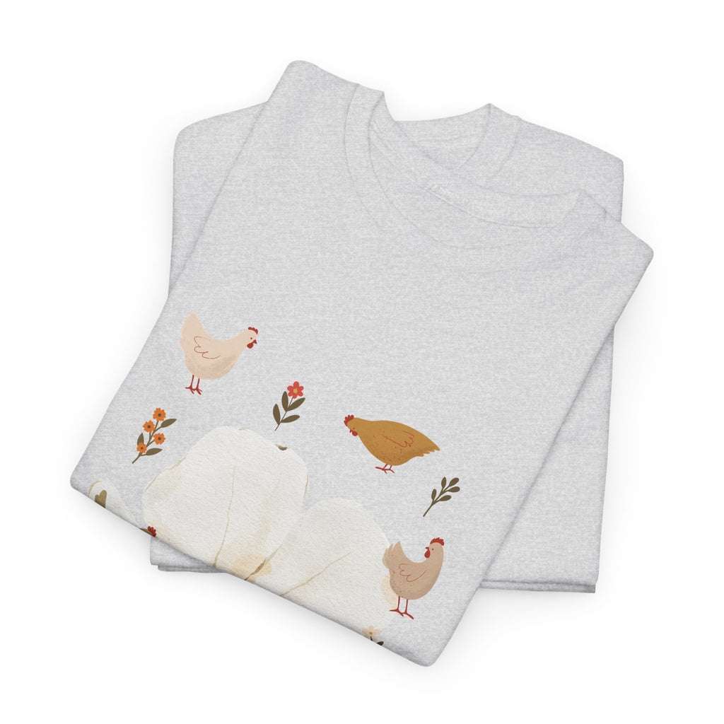 A folded grey t-shirt featuring a graphic design of a bloom surrounded by roosters in various poses.