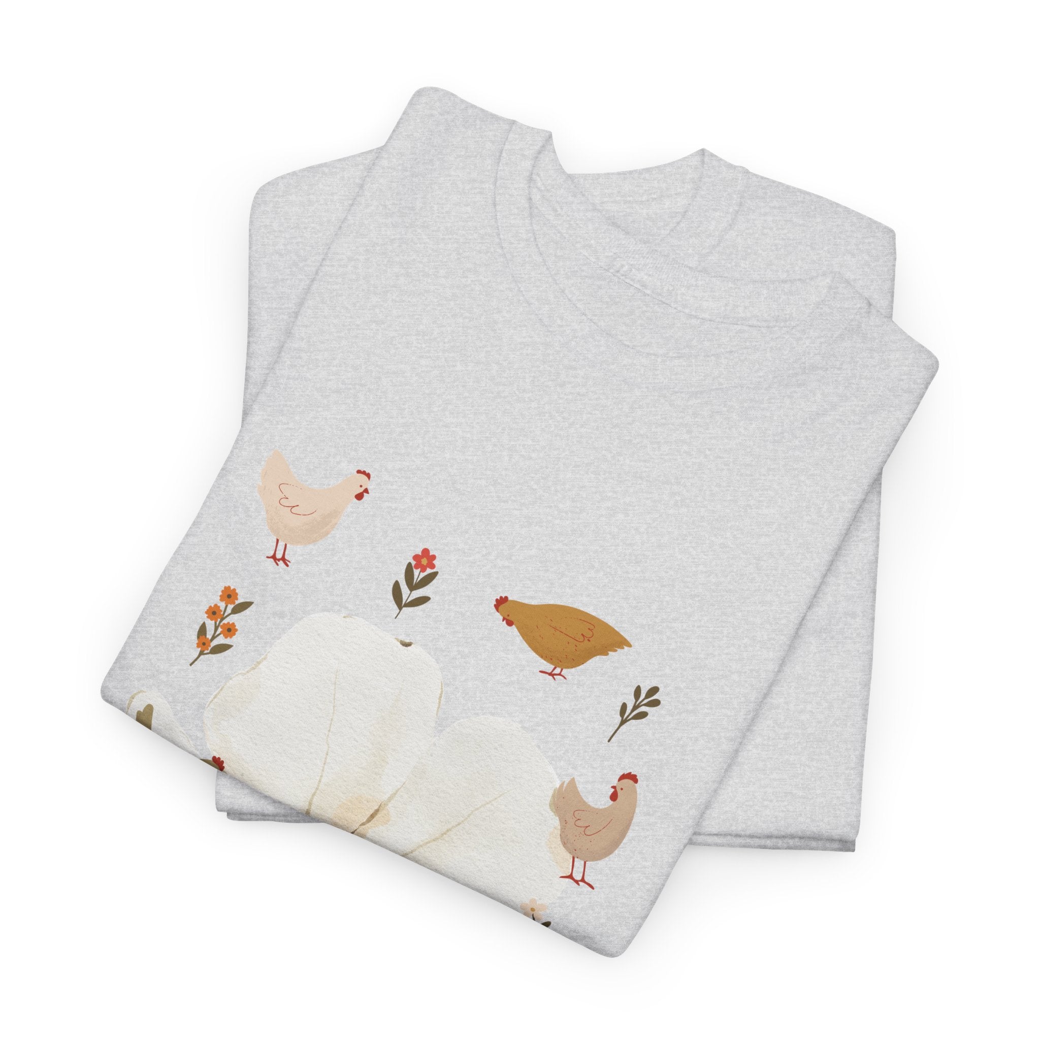 A folded grey t-shirt featuring a graphic design of a bloom surrounded by roosters in various poses.