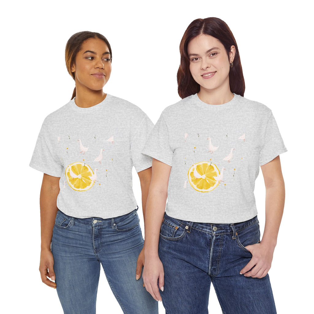 Two girls wearing grey t-shirts featuring a graphic design of white ducks filling the frame and a juicy lemon in the bottom-left corner.
