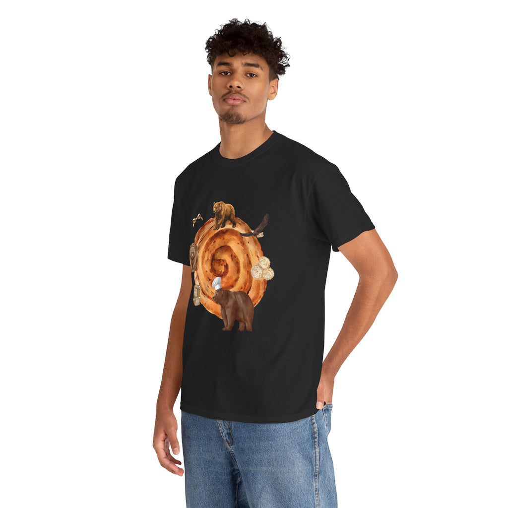 A man wearing a black t-shirt featuring a graphic design of a cinnamon roll surrounded by several hungry bears.