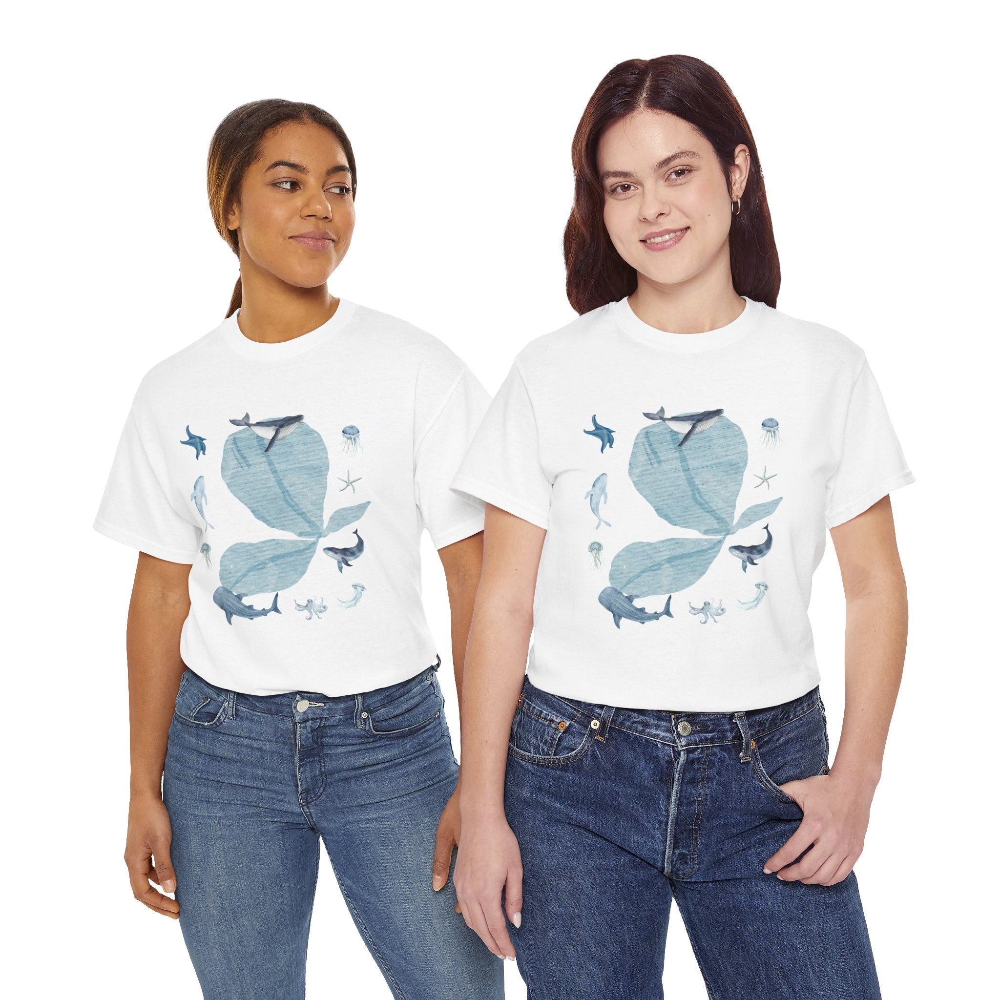 Two girls wearing white t-shirts featuring a graphic design of a blue bloom surrounded by whales, jellyfish, and starfish.