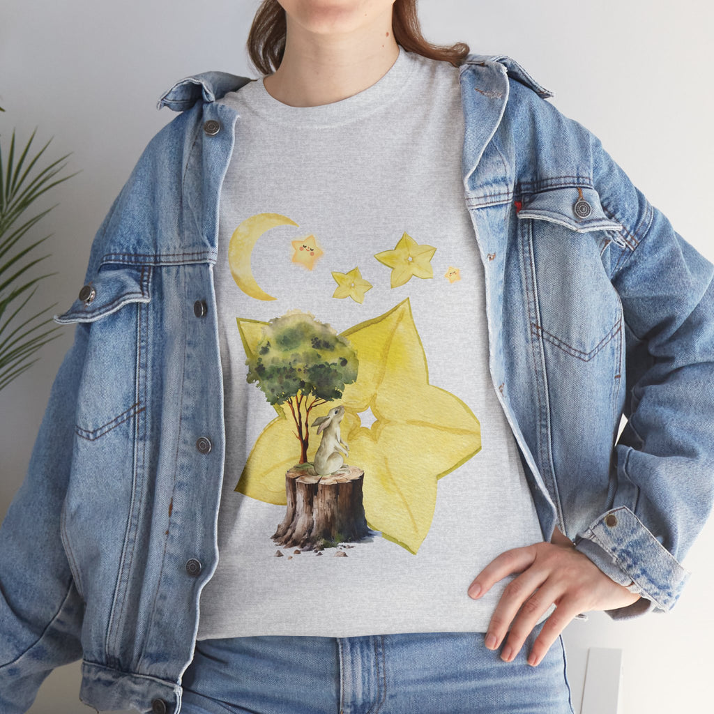 A girl wearing a denim jacket over a grey t-shirt featuring a colorful design of a tree, moon, and starfruit celestial elements.
