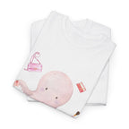 A folded white t-shirt featuring a graphic design of a pink octopus multitasking its tentacles to apply lipstick, brush on makeup, and juggle beauty accessories.