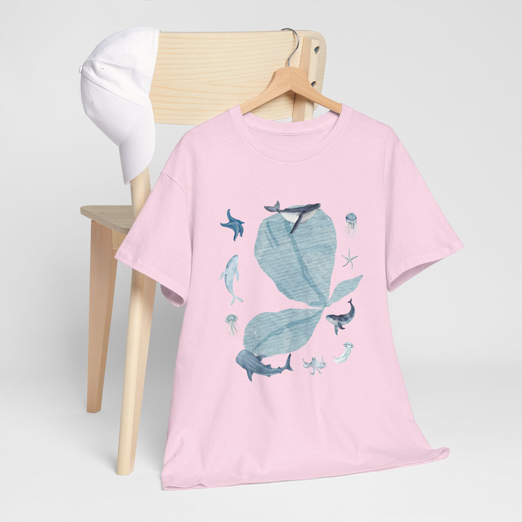 A pink t-shirt hanging on a chair, featuring a graphic design of a pink bloom surrounded by bunnies in various poses.