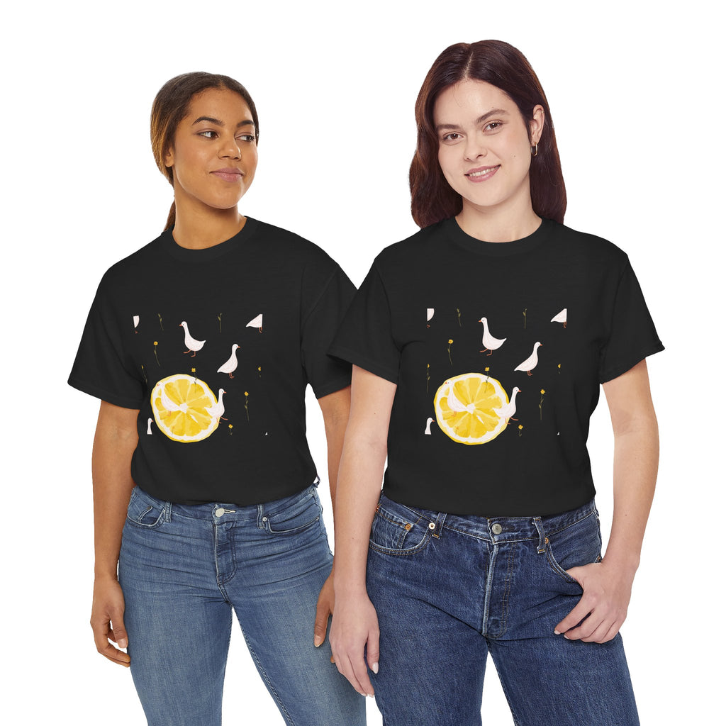 Two girls wearing black t-shirts featuring a graphic design of white ducks filling the frame and a juicy lemon in the bottom-left corner.